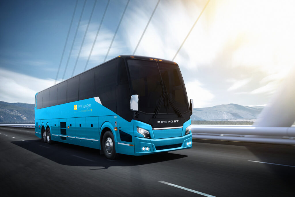 UniSky Express luxury motorcoach traveling on a West Coast highway